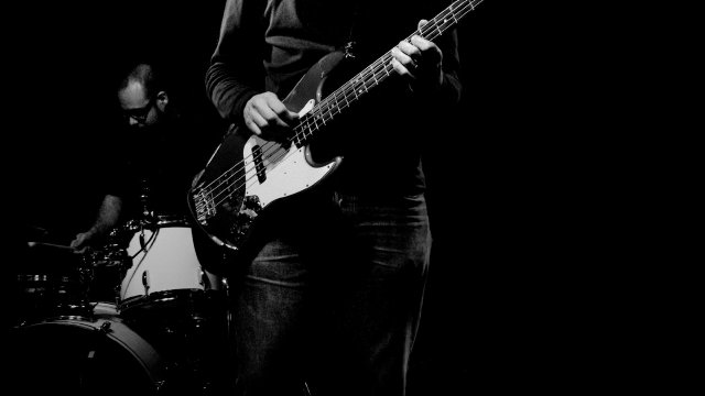 Rock band hitting a chorus on a festival mainstage